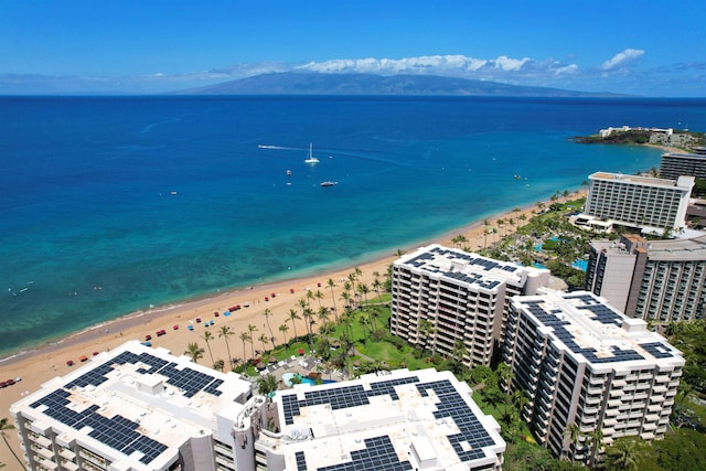 bird's eye view featuring a water view and a beach view