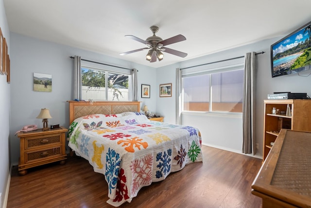 bedroom with dark wood finished floors and a ceiling fan