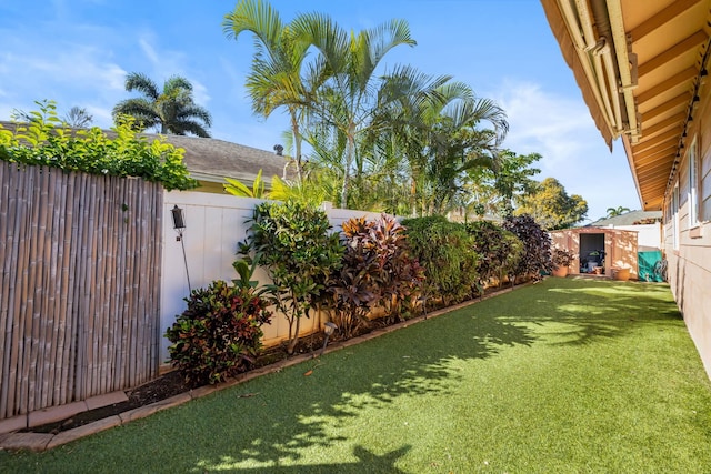 view of yard with a fenced backyard