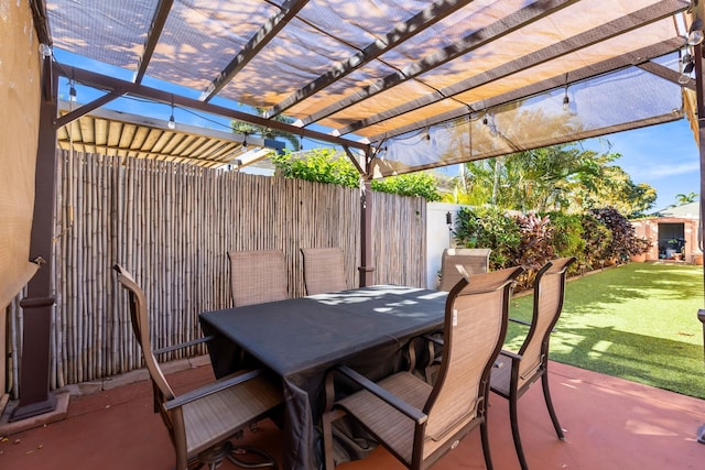 view of patio / terrace with a fenced backyard, outdoor dining area, and a pergola