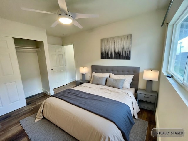 bedroom with a closet, ceiling fan, and dark hardwood / wood-style floors