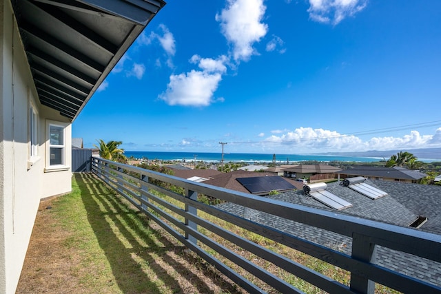 balcony featuring a water view