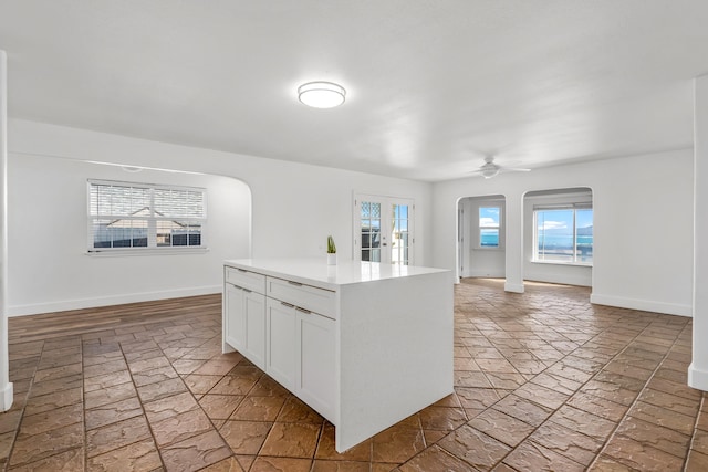 kitchen featuring white cabinets and ceiling fan