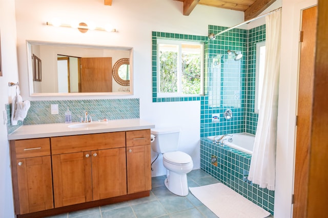 full bathroom with tile floors, toilet, vanity, and shower / tub combo with curtain