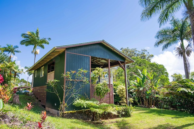 view of property exterior featuring a lawn