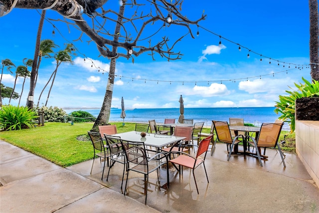 view of patio / terrace featuring outdoor dining space and a water view