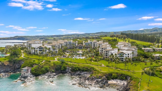 birds eye view of property featuring a water and mountain view