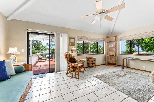 sunroom / solarium featuring ceiling fan and vaulted ceiling with beams