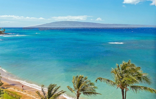 water view featuring a mountain view and a beach view