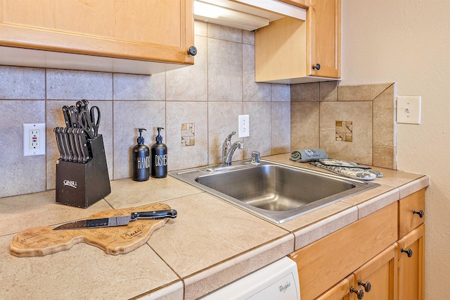 kitchen with sink and backsplash