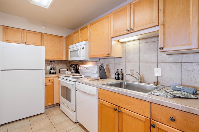 kitchen featuring backsplash, sink, white appliances, light tile patterned flooring, and light brown cabinets