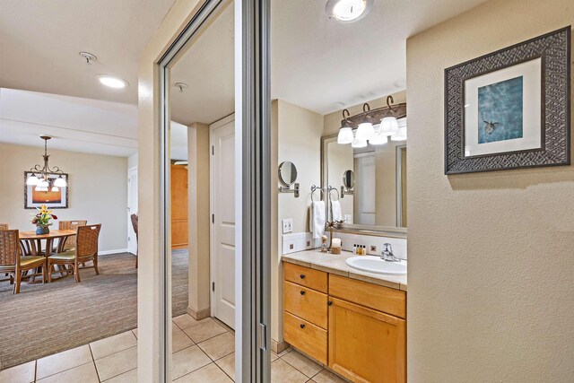 bathroom with tile patterned flooring and vanity