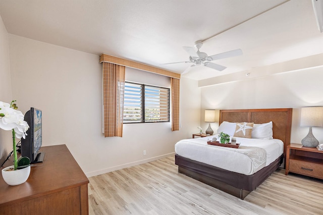 bedroom with ceiling fan and light hardwood / wood-style flooring