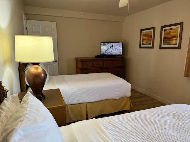 bedroom featuring ceiling fan and hardwood / wood-style floors