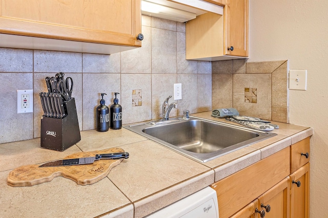 kitchen with decorative backsplash and sink