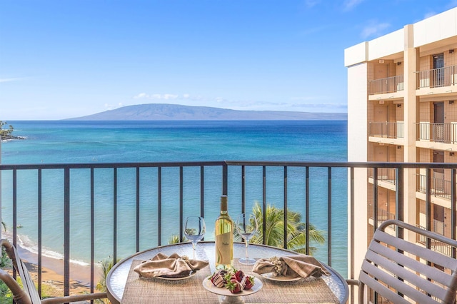 balcony with a water and mountain view