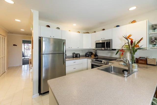 2777 S Kihei Rd Unit K 106, Kihei, HI 96753 - kitchen with stainless steel appliances, a sink, a peninsula, white cabinets, and recessed lighting