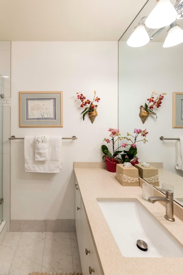 2777 S Kihei Rd Unit K 106, Kihei, HI 96753 - full bath with marble finish flooring, vanity, a shower with shower door, and baseboards