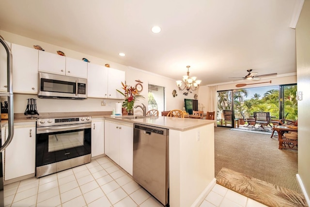 2777 S Kihei Rd Unit K 106, Kihei, HI 96753 - kitchen featuring stainless steel appliances, a peninsula, a sink, light countertops, and recessed lighting
