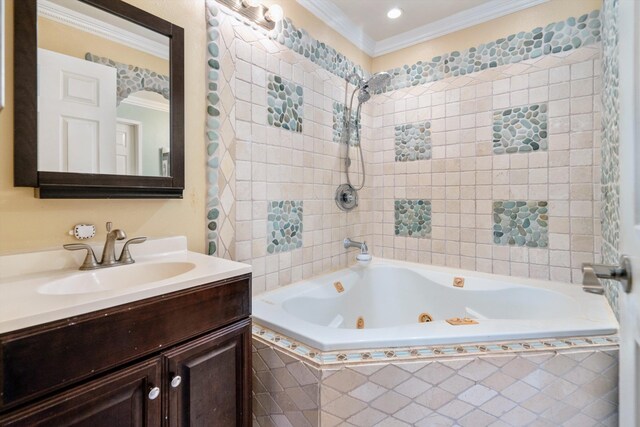 bathroom featuring vanity, crown molding, and a relaxing tiled tub