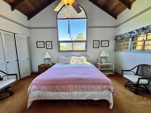 carpeted bedroom featuring ceiling fan, wood ceiling, high vaulted ceiling, and a closet