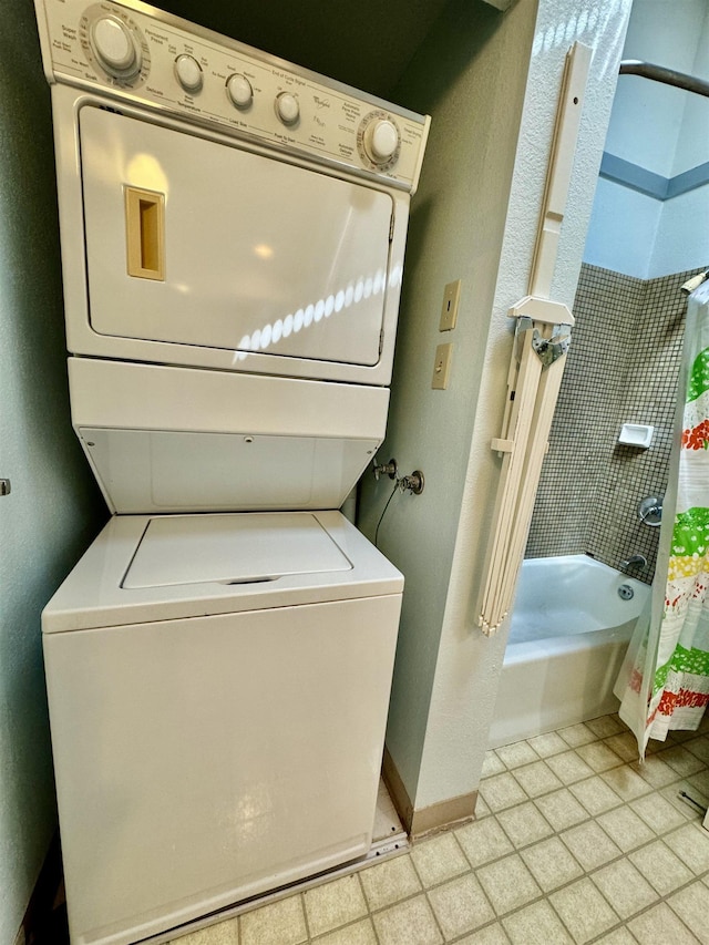 laundry room featuring stacked washer and dryer