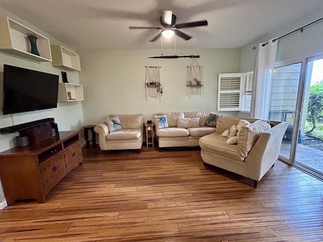 living room featuring ceiling fan and light wood-style floors