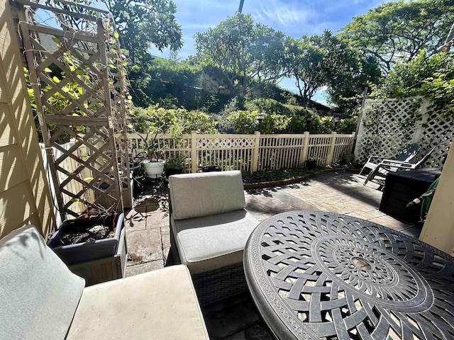 view of patio featuring fence