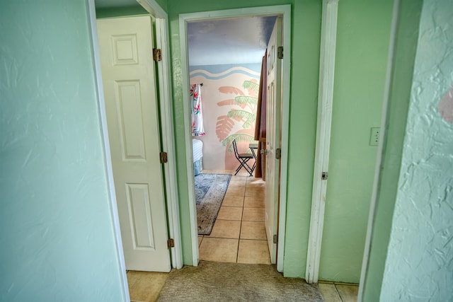 hallway featuring light tile patterned floors