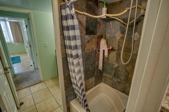 bathroom with shower / bath combo and tile patterned flooring