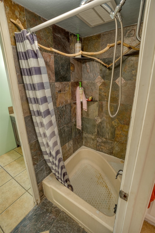 bathroom with shower / bath combo with shower curtain