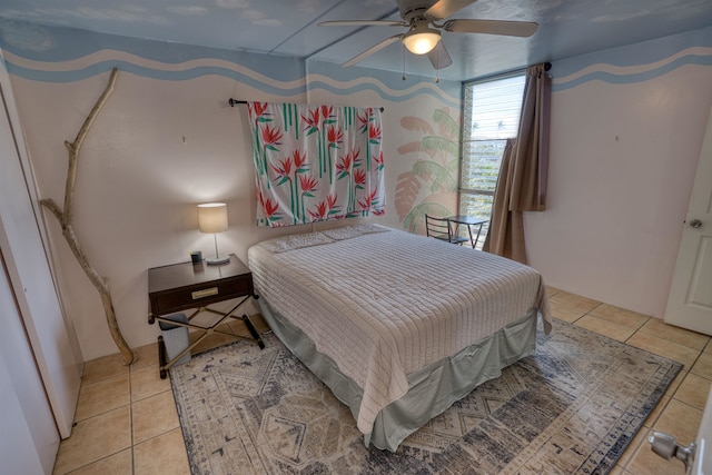 bedroom with light tile patterned floors and ceiling fan