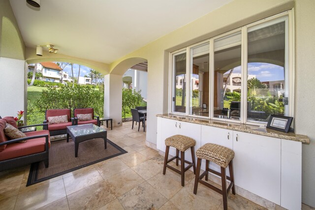 view of patio featuring outdoor lounge area and a ceiling fan