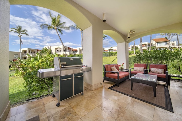 view of patio / terrace featuring a residential view, outdoor lounge area, and a grill