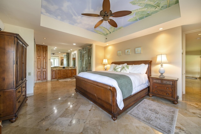 bedroom featuring baseboards, a raised ceiling, a ceiling fan, and recessed lighting