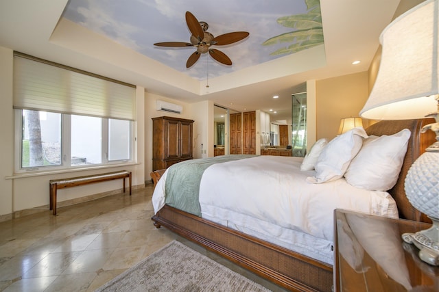 bedroom with light tile patterned floors, a raised ceiling, a ceiling fan, an AC wall unit, and baseboards