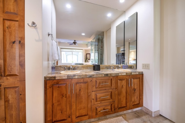 full bathroom with double vanity, ceiling fan, a sink, and recessed lighting