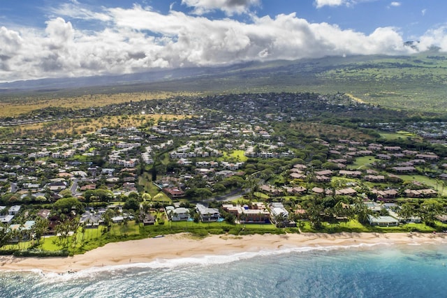 birds eye view of property with a residential view, a water view, and a beach view