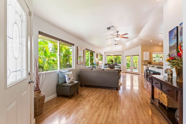 40 Hoola Lei Pl, Kihei, HI 96753 - living area featuring light wood-style flooring, french doors, baseboards, vaulted ceiling, and a ceiling fan