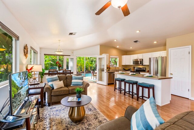 40 Hoola Lei Pl, Kihei, HI 96753 - living room featuring vaulted ceiling, light wood-type flooring, ceiling fan, and recessed lighting