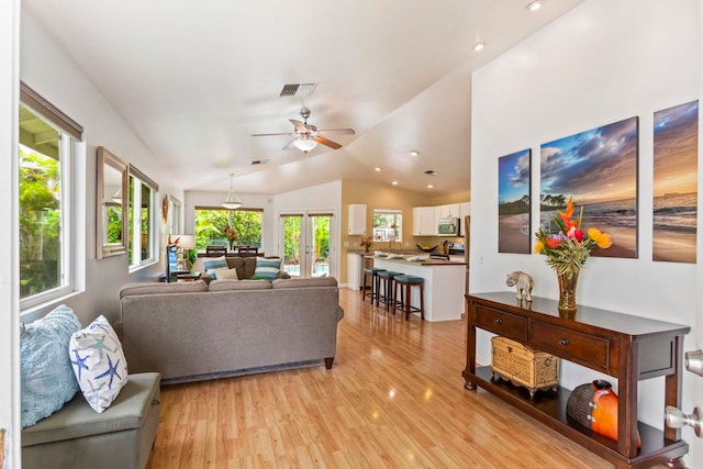 40 Hoola Lei Pl, Kihei, HI 96753 - living room with light wood finished floors, lofted ceiling, ceiling fan, and recessed lighting
