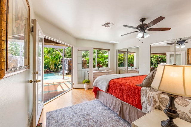 40 Hoola Lei Pl, Kihei, HI 96753 - bedroom with access to outside, multiple windows, french doors, and wood finished floors
