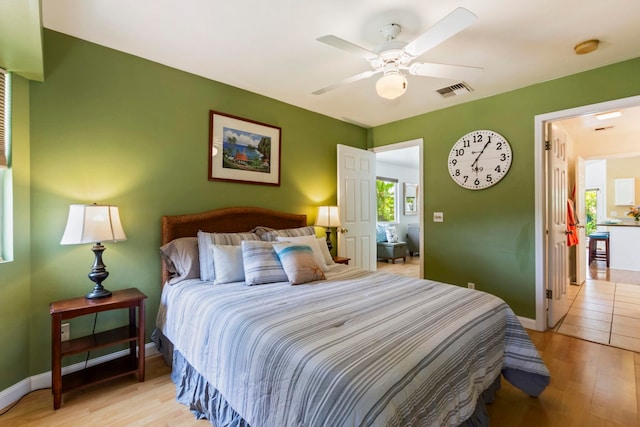 40 Hoola Lei Pl, Kihei, HI 96753 - bedroom featuring light wood finished floors, baseboards, and a ceiling fan