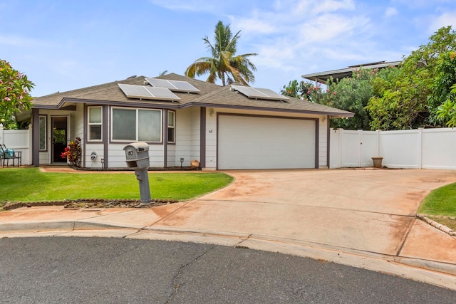 40 Hoola Lei Pl, Kihei, HI 96753 - view of front of house featuring an attached garage, driveway, solar panels, and a shingled roof