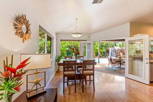 40 Hoola Lei Pl, Kihei, HI 96753 - dining space with lofted ceiling, wood finished floors, and baseboards