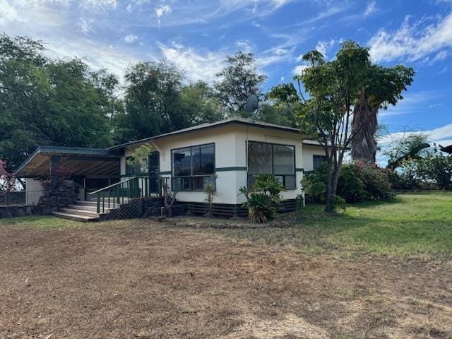 back of house with a yard