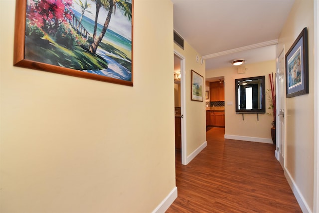 corridor with hardwood / wood-style floors