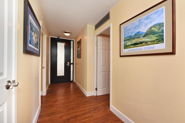 hallway with dark hardwood / wood-style floors