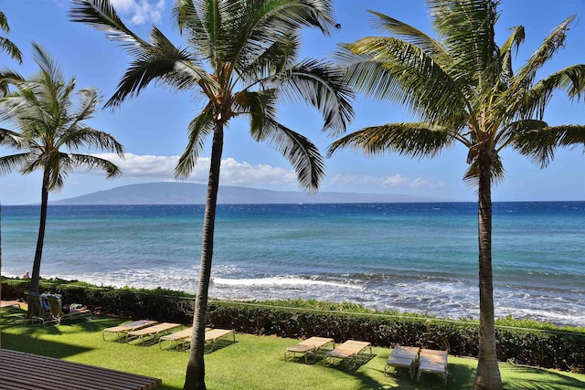 water view with a mountain view and a view of the beach