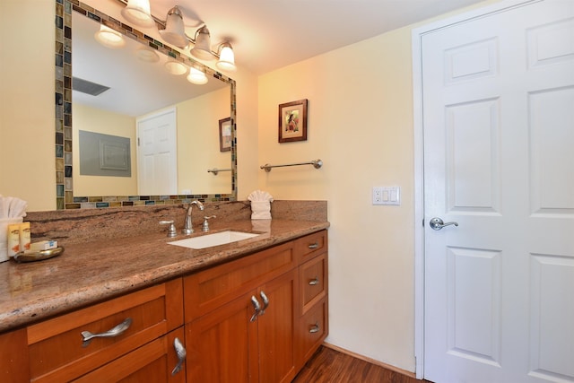 bathroom with vanity and hardwood / wood-style flooring